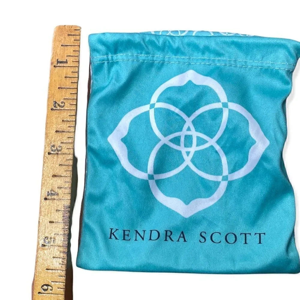Kendra Scott jewelry bag in turquoise with white signature pattern drawstring